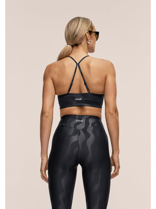Stanik sportowy CASALL Sleek Strappy Sports Bra Printed kolor czarny
