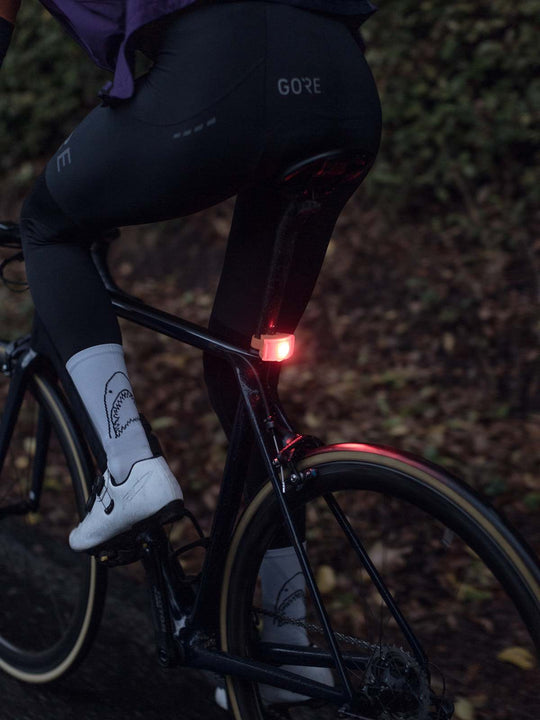 Lampka rowerowa BOOKMAN Curve Rear Light 37lm pomarańczowy
