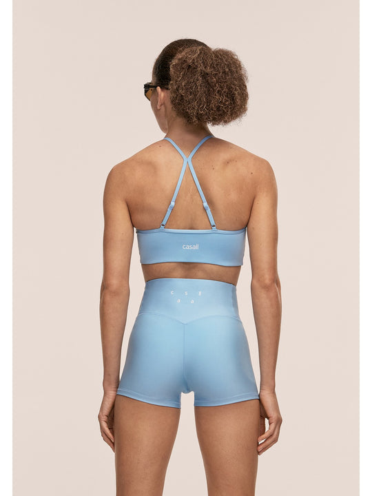 Stanik sportowy CASALL Sleek Strappy Sports Bra kolor niebieski
