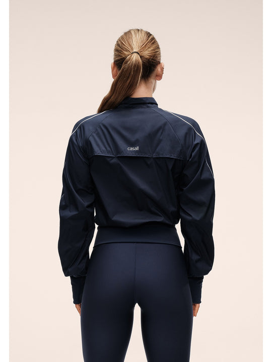 Kurtka damska CASALL Statement Woven Training Jacket granatowa
