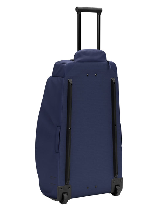 Torba podróżna na kółkach Db™ Hugger Roller Bag Check-In 90L niebieski
