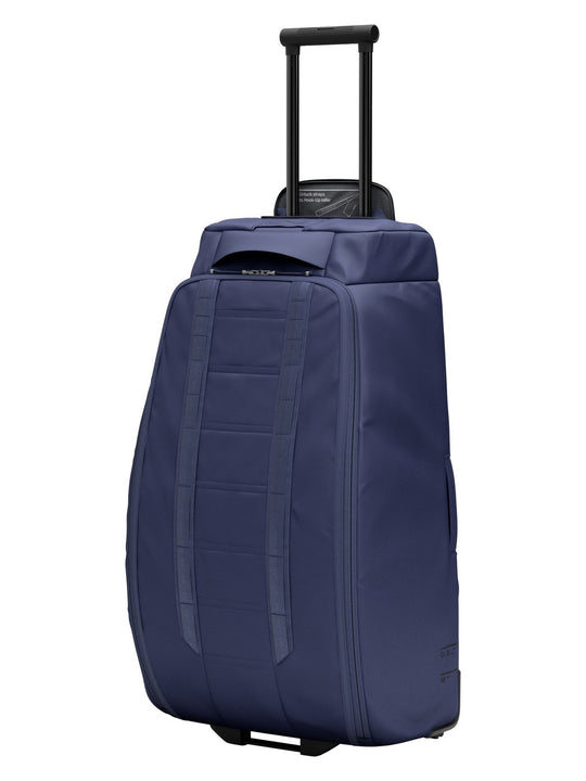 Torba podróżna na kółkach Db™ Hugger Roller Bag Check-In 90L niebieski
